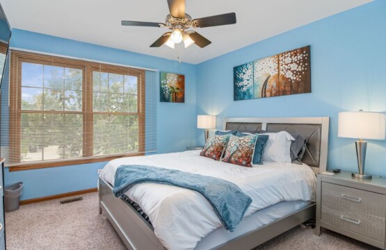 a blue-themed bedroom of a corporate home rental
