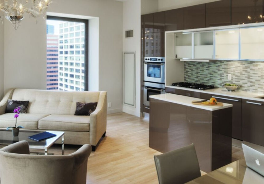 a living and kitchen area of a corporate housing