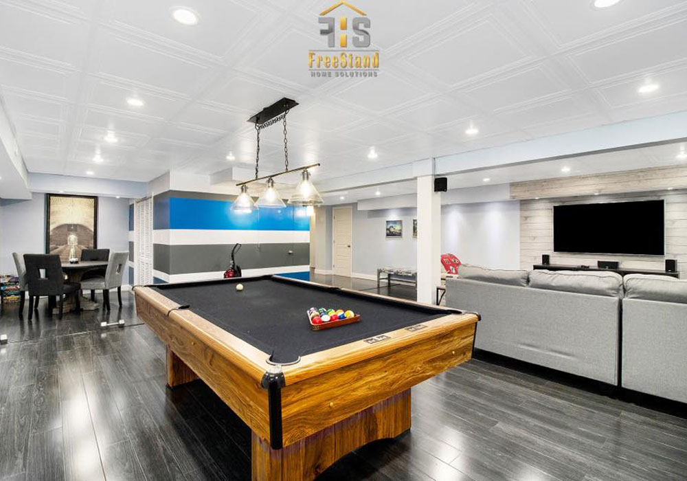 a large pool table in a corporate housing by FreeStand Home Solutions