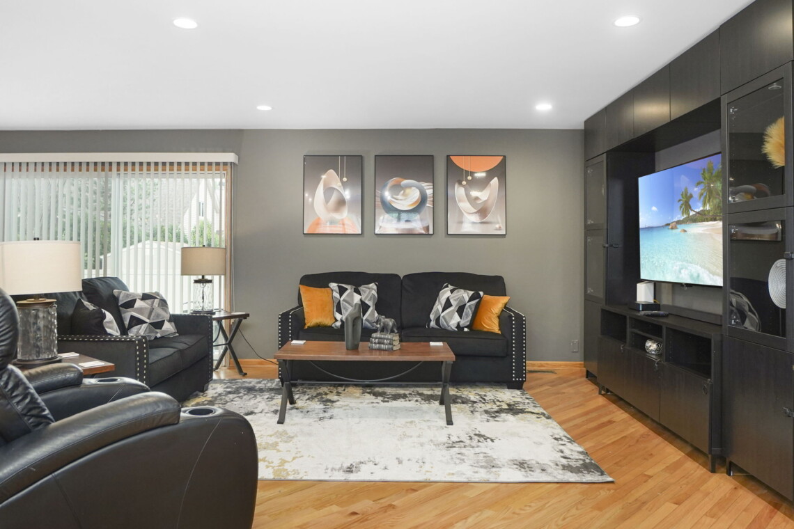 A homey black and comfortable wood entertainment room is crucial in finding corporate housing in Chicago